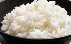 Steaming bowl of fluffy white rice, perfect for dinner sides and Asian-inspired meals.