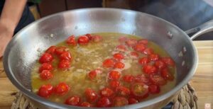 add tomatoes and wine and simmer