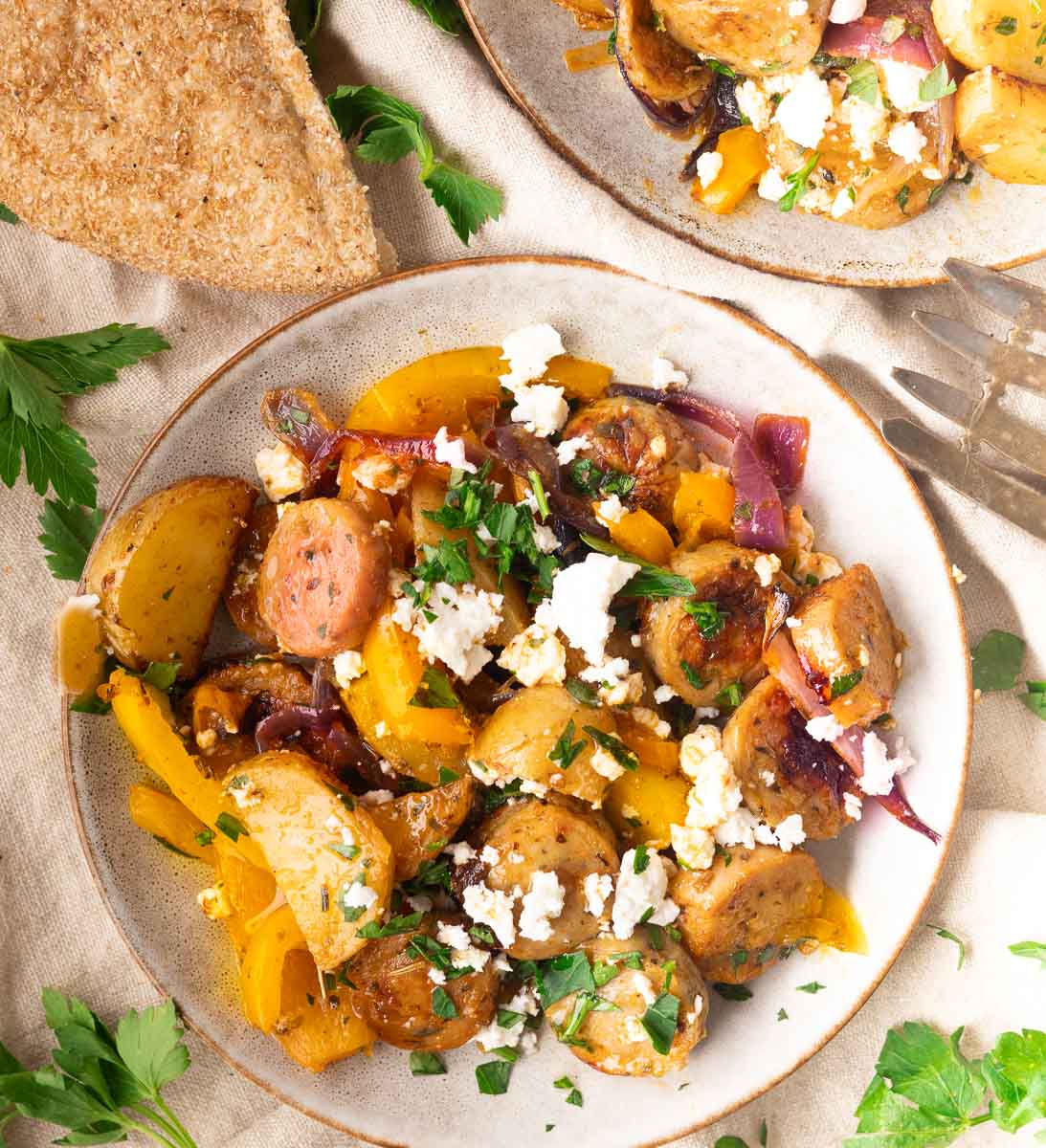 Roasted potatoes, sausage, peppers, and onions topped with feta and parsley, served with whole grain pita.