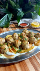 Meatballs on potatoes over whipped feta.