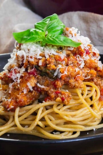 Hidden Veggie Pasta Sauce over some whole wheat spaghetti with freshly grated cheese and basil.