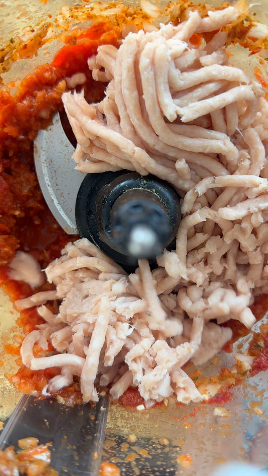 Ground meat and tomato sauce in a food processor.