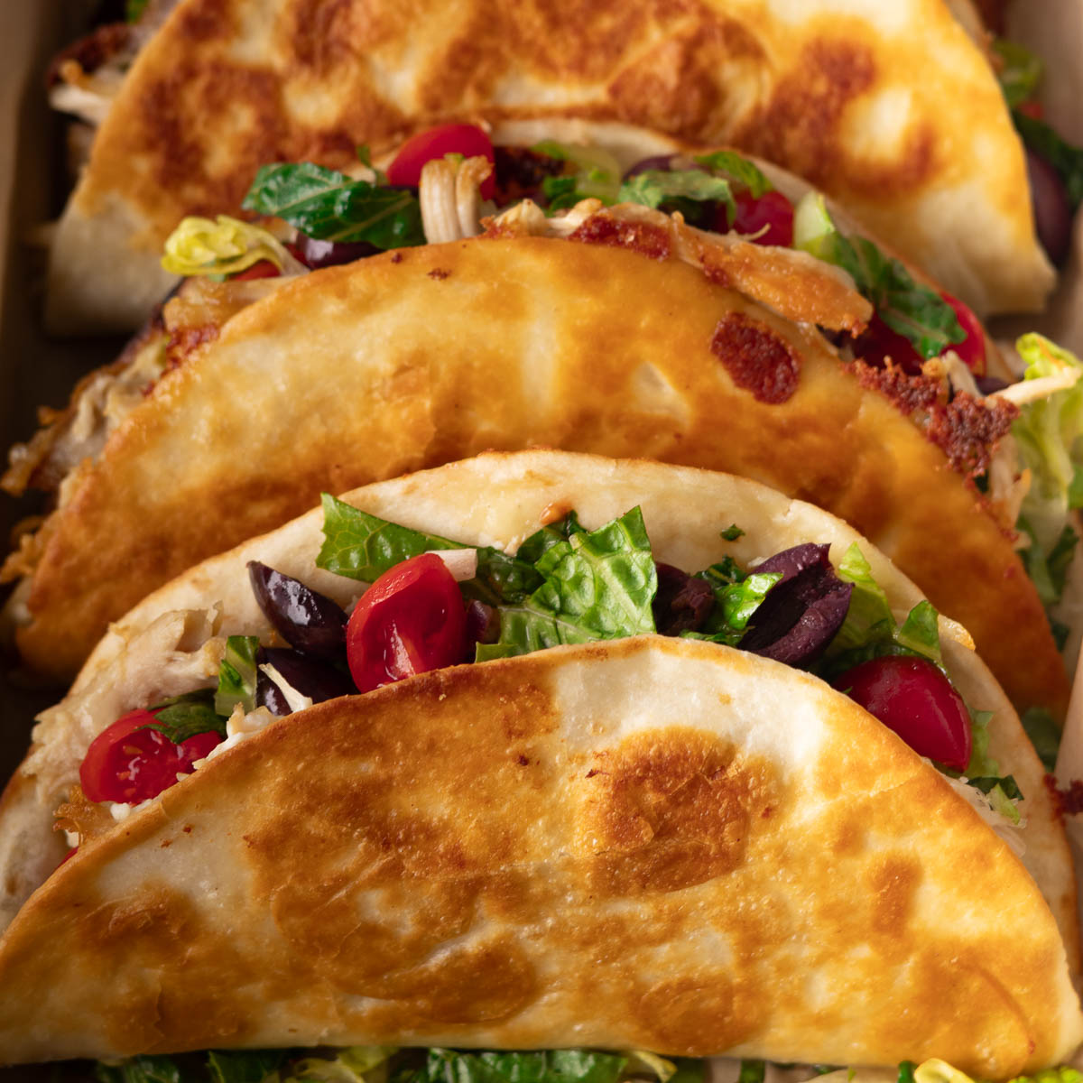 crispy tacos with lettuce tomatoes 