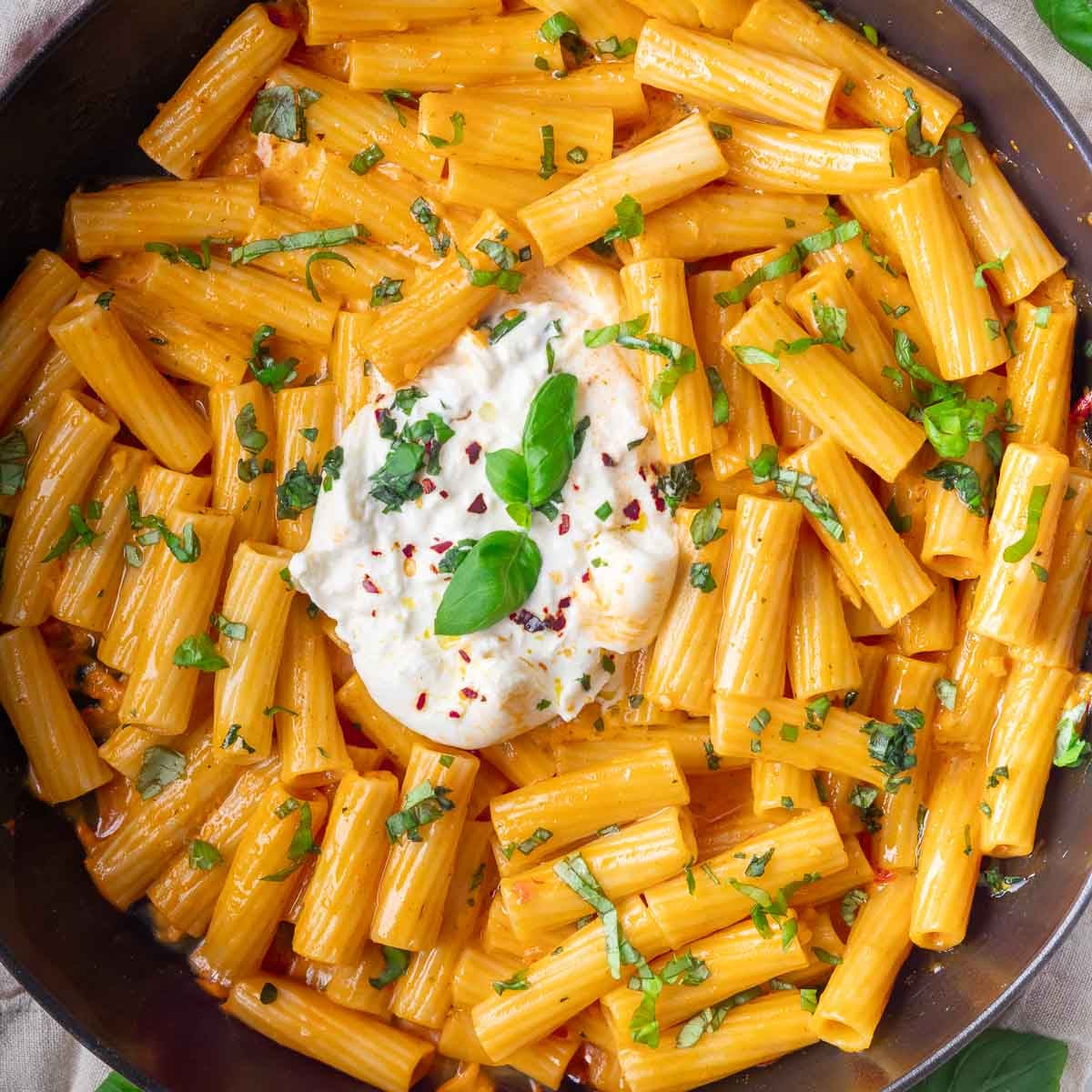 cheesy pasta with burrata in the middle