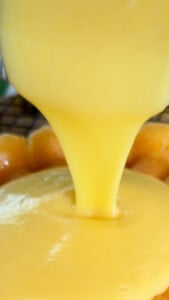 Pouring yellow batter or sauce.