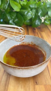 Whisk above bowl with sauce.