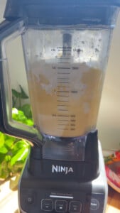 Ninja blender with floud added to a mix.