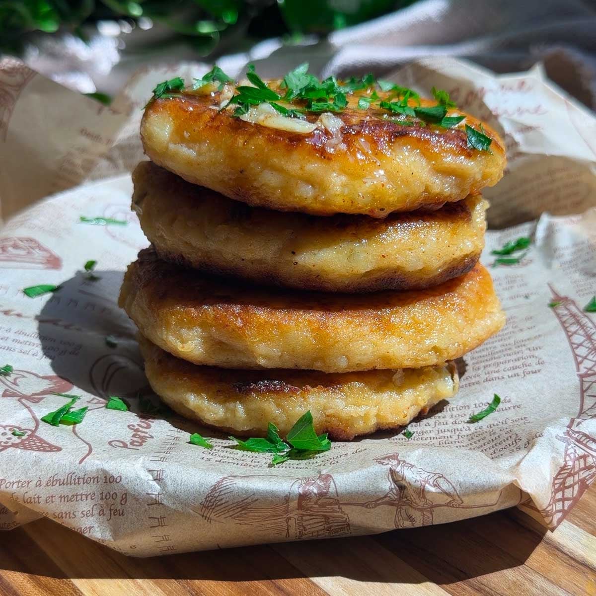stacked tuna potato cakes with greens