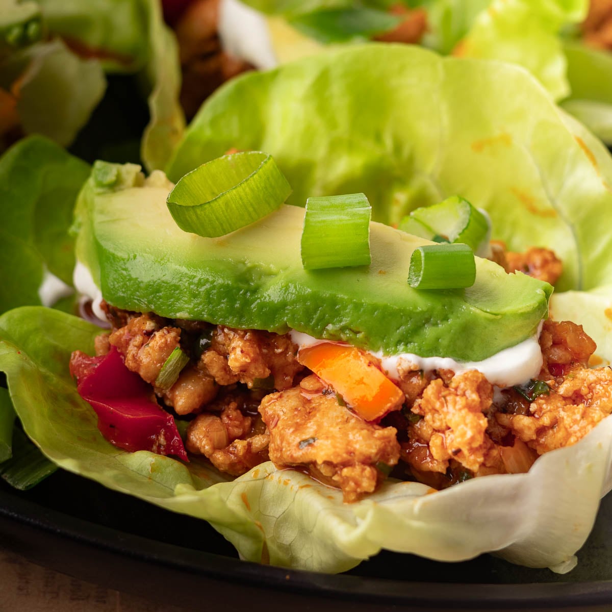 butter lettuce with ground chicken and toppings