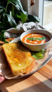 Tomato soup with basil and grilled cheese sandwich.